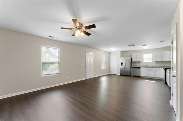 222 Parkland Way, Chatsworth, GA 30705 - unfurnished living room featuring a ceiling fan, dark wood-type flooring, and healthy amount of natural light