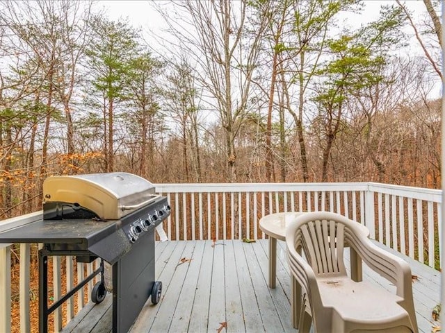 wooden terrace featuring area for grilling