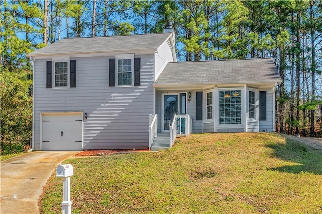 split level home with a garage, driveway, a chimney, and a front lawn