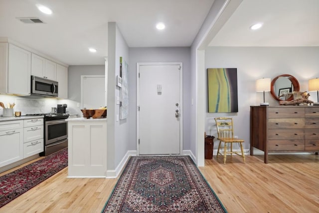 entrance foyer featuring light wood-type flooring