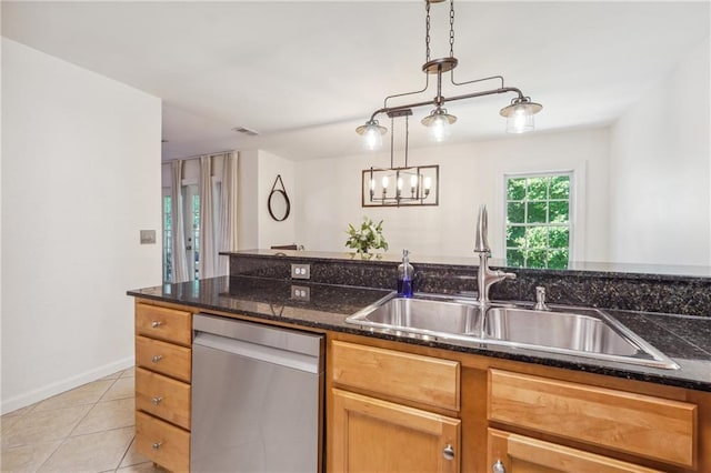 kitchen with light tile patterned floors, a sink, visible vents, stainless steel dishwasher, and decorative light fixtures