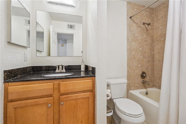 full bathroom with a textured wall, toilet, vanity, visible vents, and shower / bathtub combination with curtain