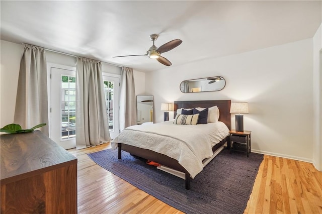 bedroom with light wood finished floors, baseboards, access to exterior, and a ceiling fan