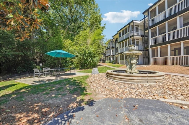 surrounding community featuring a patio