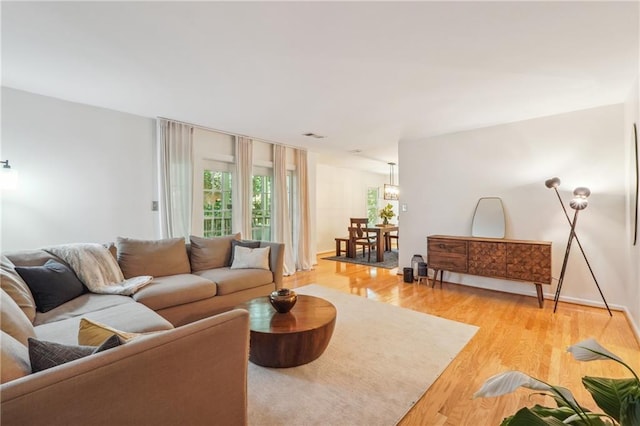 living room with light wood-style floors and baseboards