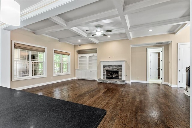 214 Westwind Dr, Newnan, GA 30263 - unfurnished living room with ceiling fan, wood finished floors, beamed ceiling, coffered ceiling, and a stone fireplace