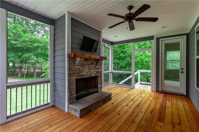 214 Westwind Dr, Newnan, GA 30263 - wooden terrace with a stone fireplace and ceiling fan