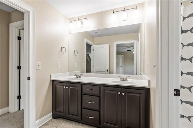 214 Westwind Dr, Newnan, GA 30263 - full bathroom featuring double vanity, baseboards, and tile patterned floors