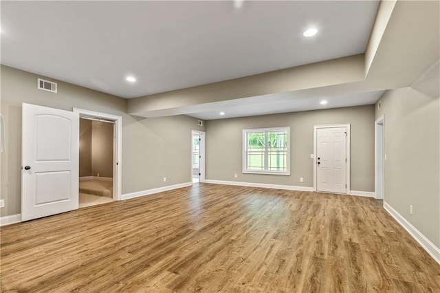 214 Westwind Dr, Newnan, GA 30263 - unfurnished living room featuring light wood-type flooring, baseboards, and recessed lighting