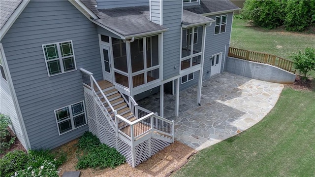 214 Westwind Dr, Newnan, GA 30263 - back of property with a patio area, a shingled roof, a sunroom, a yard, and a deck