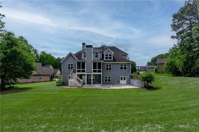 214 Westwind Dr, Newnan, GA 30263 - rear view of property featuring a patio area, a chimney, a lawn, and stairs