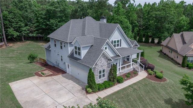 214 Westwind Dr, Newnan, GA 30263 - view of front facade featuring a porch, a garage, concrete driveway, stone siding, and roof with shingles