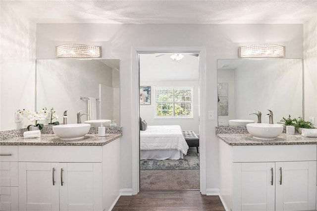 3440 Oaktree Way, Stonecrest, GA 30038 - ensuite bathroom with two vanities and wood finished floors
