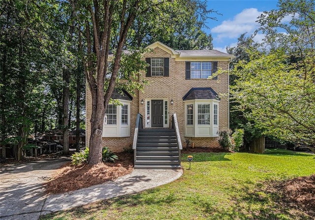 3440 Oaktree Way, Stonecrest, GA 30038 - view of front facade featuring a front yard, brick siding, and driveway