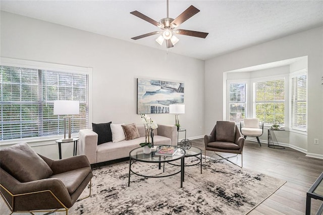 3440 Oaktree Way, Stonecrest, GA 30038 - living room with healthy amount of natural light, ceiling fan, and wood finished floors