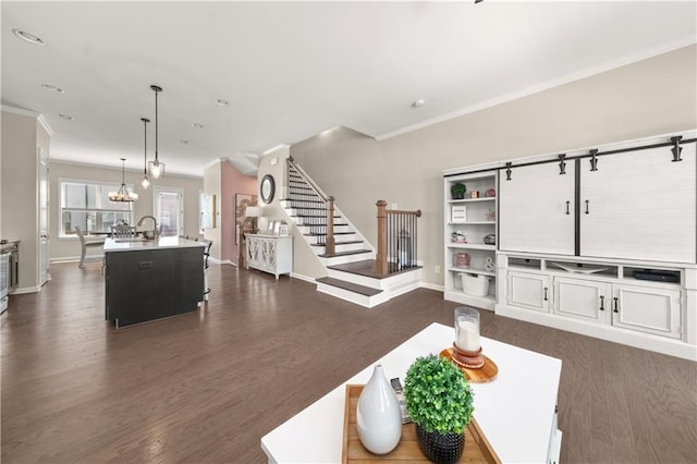 20057 Windalier Way, Roswell, GA 30076 - living area with stairway, dark wood finished floors, ornamental molding, and a chandelier