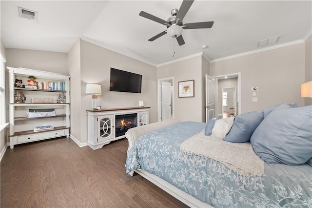 20057 Windalier Way, Roswell, GA 30076 - bedroom with dark wood-style floors, crown molding, a glass covered fireplace, a ceiling fan, and multiple windows