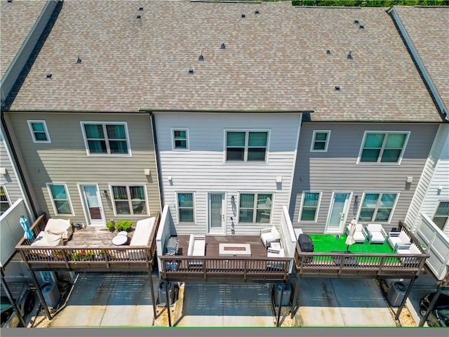 20057 Windalier Way, Roswell, GA 30076 - back of property featuring an outdoor hangout area, a patio, a wooden deck, and a shingled roof