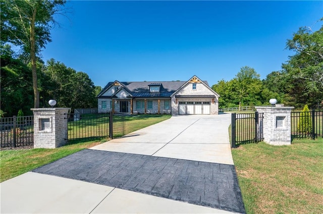 view of front of home with a garage and a front lawn