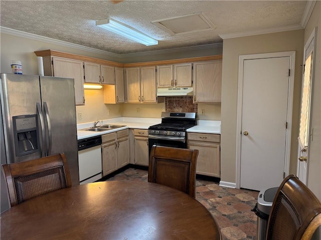 kitchen with a textured ceiling, appliances with stainless steel finishes, a sink, light countertops, and under cabinet range hood