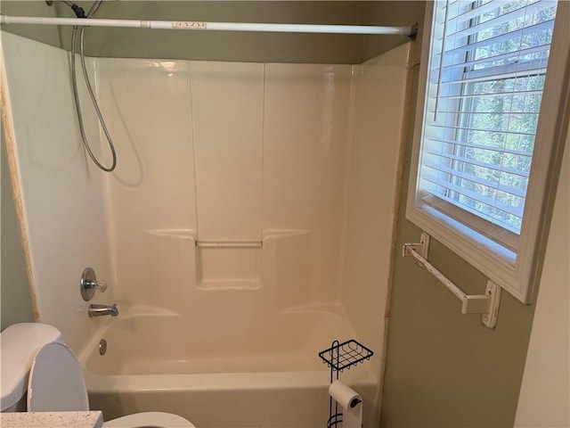 full bath with shower / bath combination and toilet