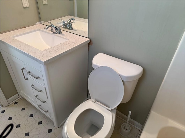 bathroom featuring vanity and toilet