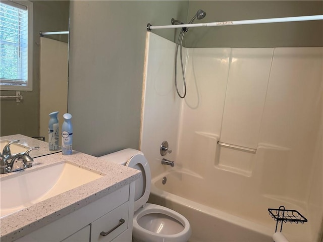 full bathroom with washtub / shower combination, vanity, and toilet