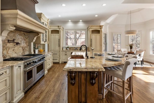 2250 Blackheath Trce, Alpharetta, GA 30005 - kitchen with cream cabinetry, double oven range, premium range hood, crown molding, and healthy amount of natural light