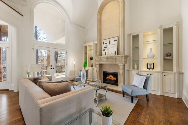 2250 Blackheath Trce, Alpharetta, GA 30005 - living room featuring high vaulted ceiling, a fireplace, dark wood-style flooring, plenty of natural light, and built in shelves