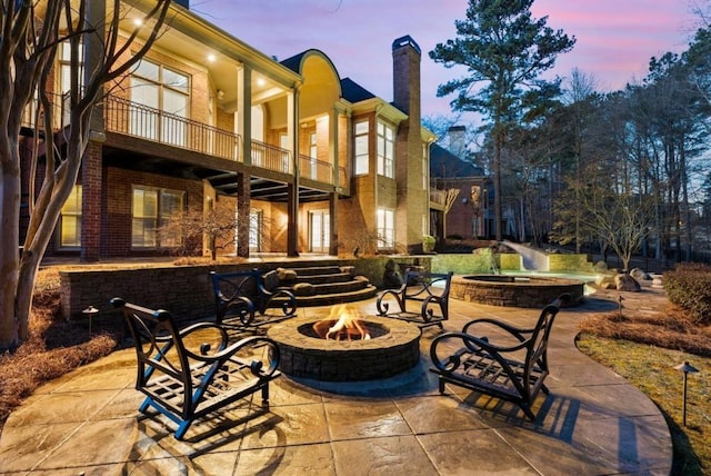 2250 Blackheath Trce, Alpharetta, GA 30005 - patio / terrace with an outdoor fire pit and a patio area