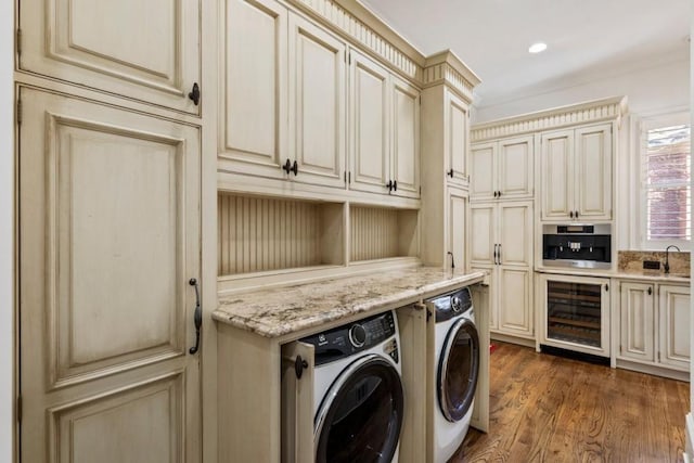2250 Blackheath Trce, Alpharetta, GA 30005 - laundry room featuring wine cooler, washing machine and clothes dryer, cabinet space, dark wood-style floors, and recessed lighting