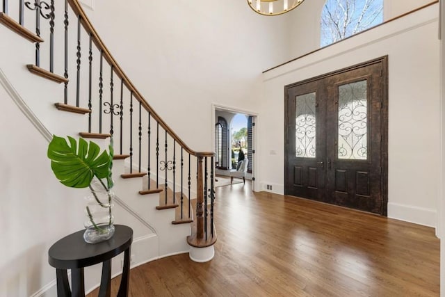 2250 Blackheath Trce, Alpharetta, GA 30005 - foyer featuring wood finished floors, stairway, and a towering ceiling