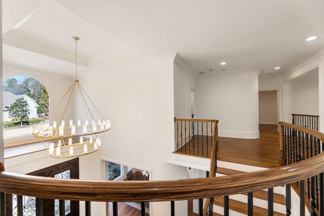 2250 Blackheath Trce, Alpharetta, GA 30005 - hallway featuring an upstairs landing, wood finished floors, a chandelier, recessed lighting, and ornamental molding
