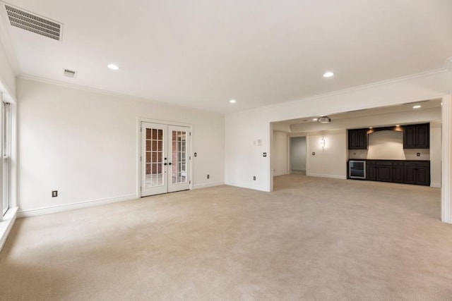 2250 Blackheath Trce, Alpharetta, GA 30005 - unfurnished living room with ornamental molding, recessed lighting, light carpet, and french doors