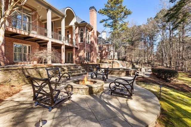 2250 Blackheath Trce, Alpharetta, GA 30005 - patio / terrace featuring a fire pit and a patio area
