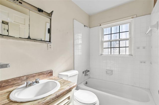 bathroom featuring shower / tub combination, vanity, and toilet