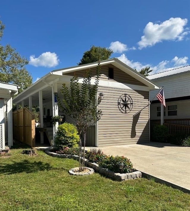 rear view of property with a lawn