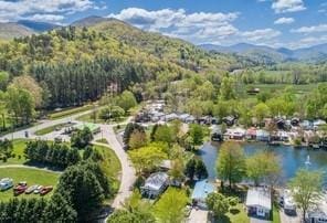 bird's eye view with a water and mountain view