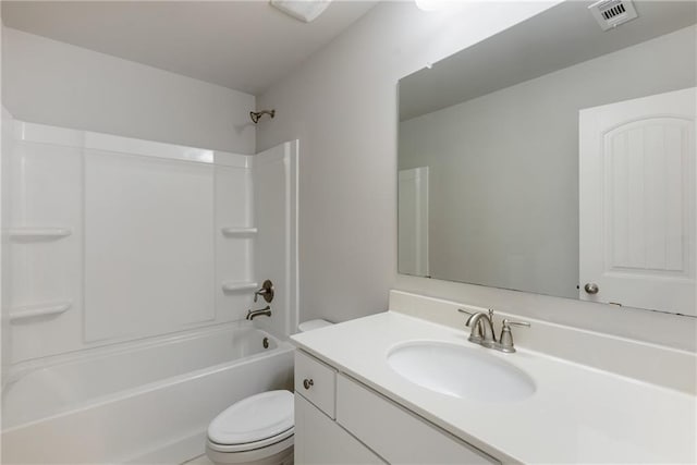 full bathroom with toilet, vanity, and  shower combination