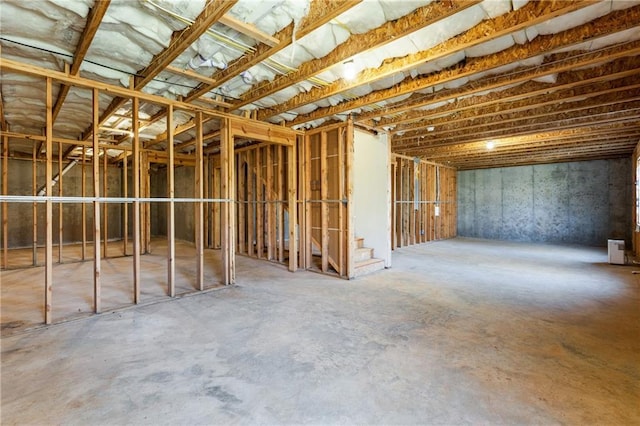 misc room with concrete flooring