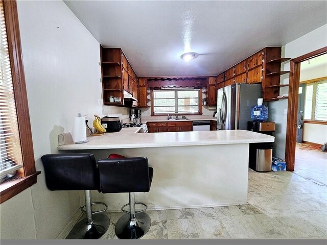 2480 Sewell Mill Rd, Marietta, GA 30062 - kitchen with open shelves, range, under cabinet range hood, and light countertops