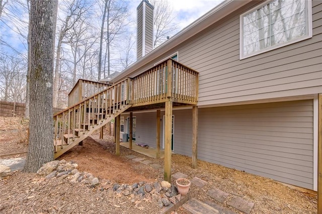 back of house featuring a wooden deck