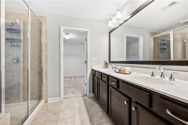 bathroom with vanity, tile patterned floors, and an enclosed shower