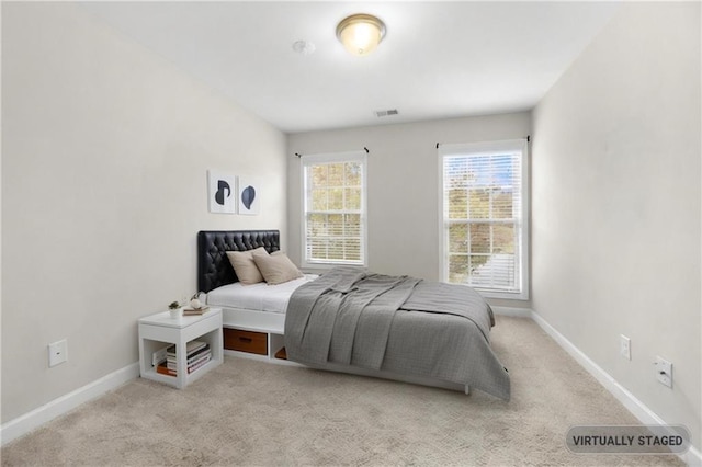 bedroom with light carpet