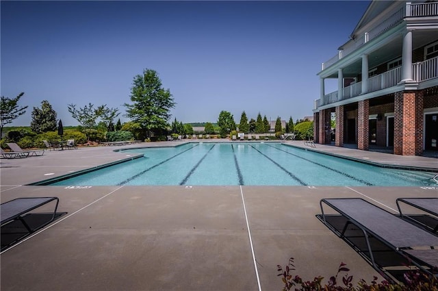 view of swimming pool featuring a patio area