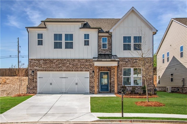 4202 Adler Cir, Buford, GA 30519 - view of front of home with board and batten siding, a front lawn, brick siding, an attached garage, and concrete driveway