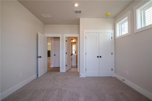 4202 Adler Cir, Buford, GA 30519 - spare room with baseboards, light colored carpet, and a healthy amount of sunlight
