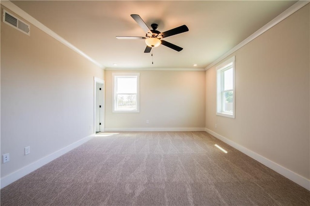 4202 Adler Cir, Buford, GA 30519 - spare room featuring visible vents, baseboards, ceiling fan, crown molding, and light carpet