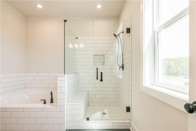 4202 Adler Cir, Buford, GA 30519 - bathroom with a shower stall, double vanity, a bath, and a sink