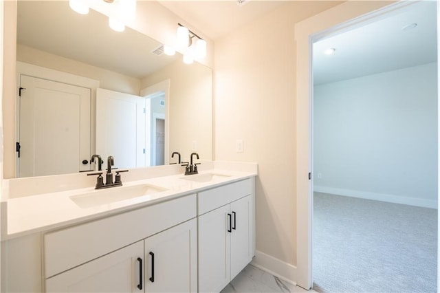 4202 Adler Cir, Buford, GA 30519 - bathroom with baseboards, visible vents, marble finish floor, and a sink
